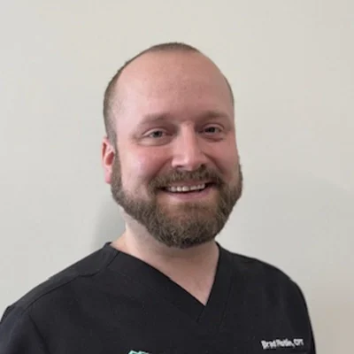Headshot of Bradley wearing a black top. Bradley is an exercise specialist at Klahanie Chiropractic