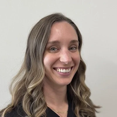 Headshot of Casey wearing a black top. Casey is a chiropractor at Klahanie Chiropractic